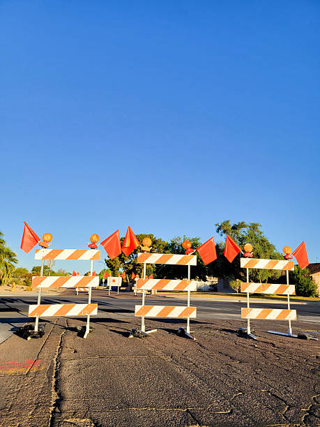 istock Road Maintenance Restriction with Traffic Control Barricade, Safety Lights and Red Flags 2218278340