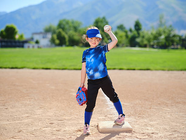 istock Little Girl Baseball Player 2218279412