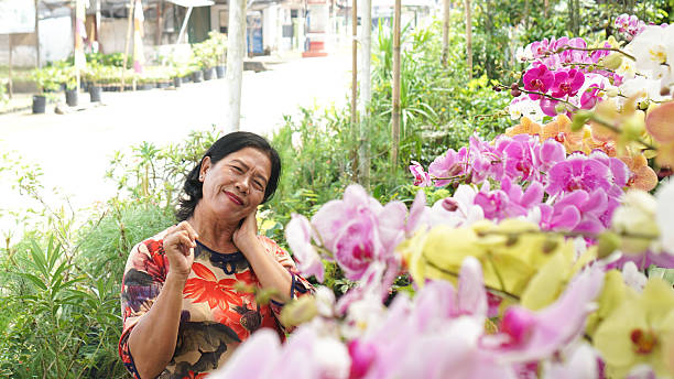 istock smiling mother on orchid garden 2218279718