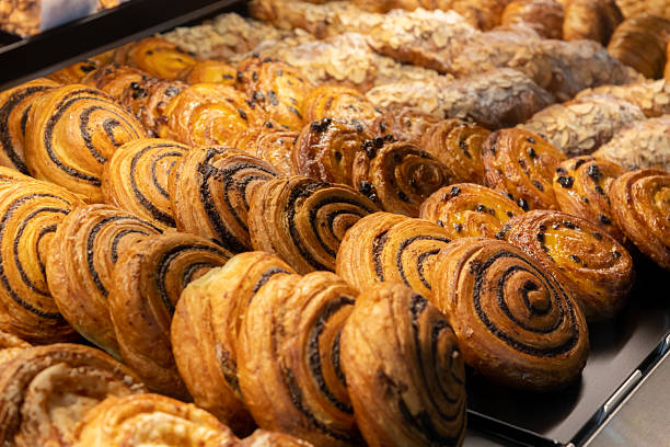 istock Assorted pastries displayed in a bakery showcase during morning hours 2218283520