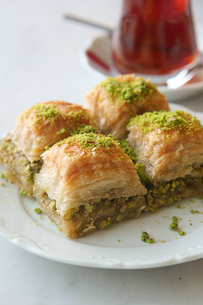 istock Sweet baklava dessert served with tea in a cozy setting 2218284030