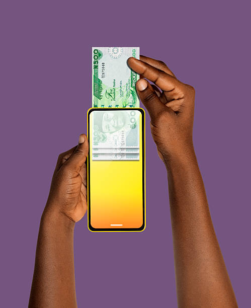 istock Black African hand Withdrawing pulling removing transferring Nigerian Naira notes through smart mobile phone screen. Online banking transfer receiving payment. money business transaction concept app 2218284065