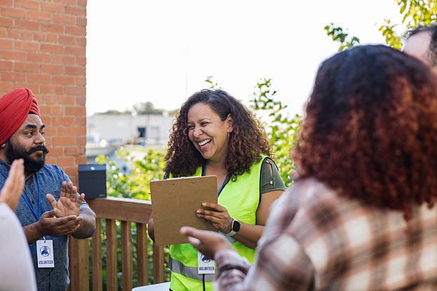 istock Diverse Group of Volunteers Meeting Outdoors, Discussing Plans 2218284861