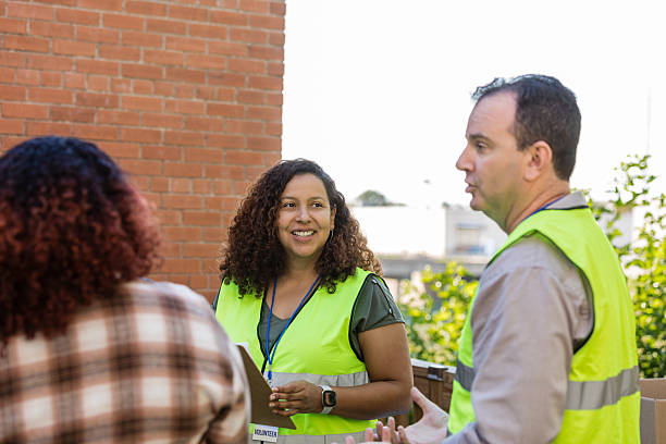 istock Community Outreach Volunteers Discussing Support and Assistance 2218284862