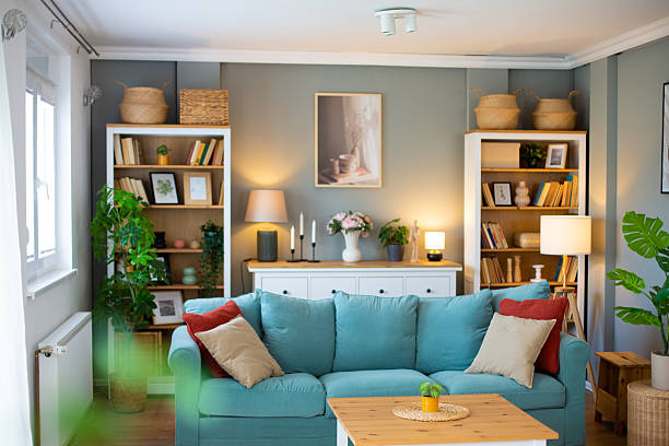 istock Modern living room interior design featuring turquoise sofa and bookshelves 2218285845