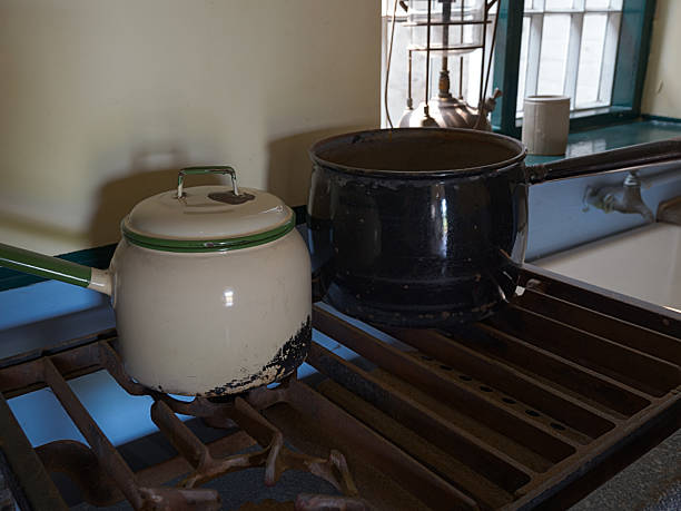 Antique silver stove standing in an old, uninhabited kitchen, showcasing a glimpse into the past