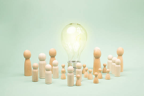 istock Crowd of people standing around light bulb, education and science concept, learning new skill, have wisdom and knowledge, creative mind, back to school 2218291390