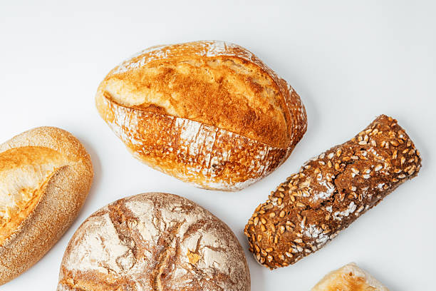 istock Baked bread varieties displayed on a clean surface with natural lighting 2218291595