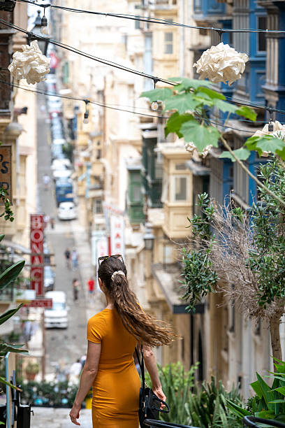 istock Woman explores narrow streets, Birgu, Valetta 2218292521