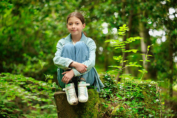 Smiling young woman in a green grass field