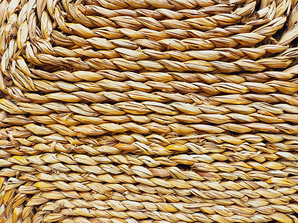 istock A fragment of a woven straw texture. Abstract background 2218298694