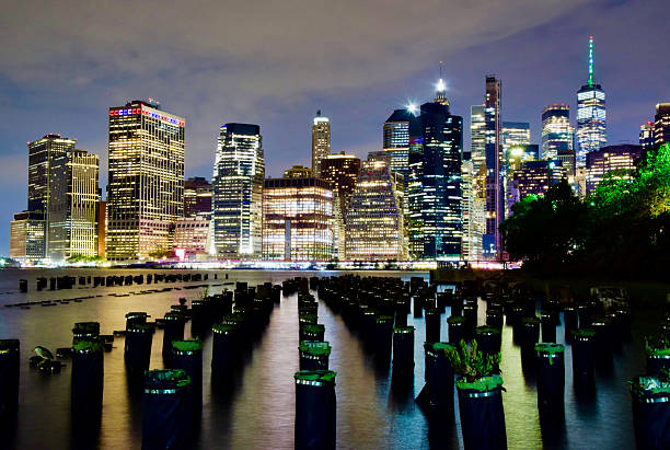 Iconic urban view of New York City with its skyscrapers by night. A modern representation of American urban architecture.