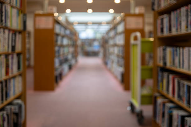 istock Hazy View of Library Shelves – Invitation to Knowledge 2218301329
