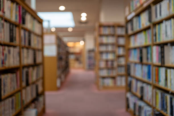 istock Hazy View of Library Shelves – Invitation to Knowledge 2218301347
