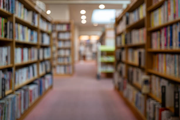 istock Hazy View of Library Shelves – Invitation to Knowledge 2218301387