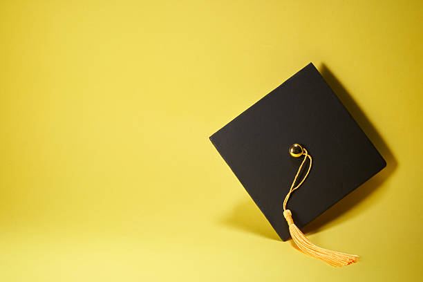 small mortarboard against yellow background