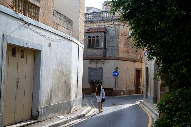 istock Woman explores old town 2218302616