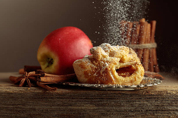 istock Viennese strudel with apple and cinnamon on old wooden table. 2218304782