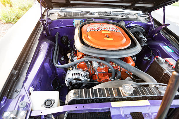 Park Ridge, Illinois, USA - August 22, 2024: 1970 Dodge Challenger engine car part. Engine powertrain of Dodge Challenger vehicle. Open engine of Dodge Challenger.
