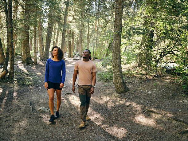 istock Young Couple on a Day Hike in the Forest 2218308445