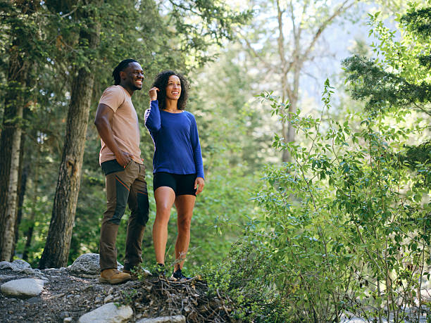 istock Young Couple on a Day Hike in the Forest 2218308526