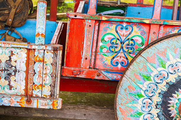 Decorative wheel from a traditional Costa Rican ox cart, featuring detailed hand-painted patterns. The art of ox cart painting has become a national symbol and is recognized by UNESCO as part of the country's intangible cultural heritage