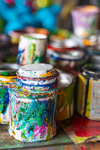 A set of open paint cans in a workshop in Sarchí, where artisans craft the vivid designs seen on Costa Rica’s iconic hand-painted ox carts. Each color is chosen with care to reflect tradition and local style.