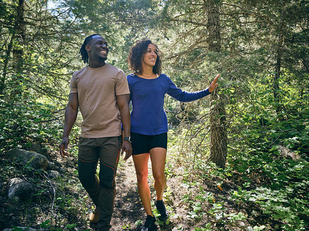istock Young Couple on a Day Hike in the Forest 2218308663