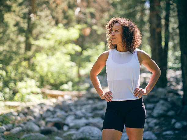 A young woman on a hike in a wilderness forest area. Utah, USA.