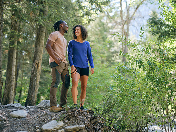 istock Young Couple on a Day Hike in the Forest 2218309040