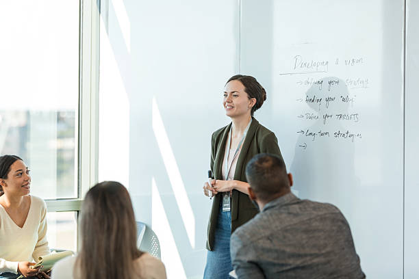 istock Businesswoman Leading a Team Meeting, Explaining Vision Strategy 2218313167
