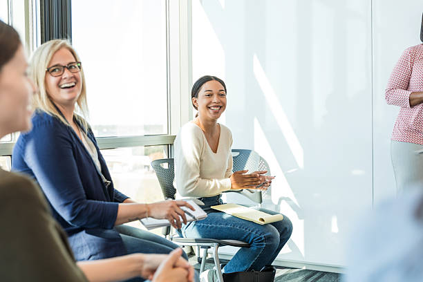 istock Diverse Women in a Group Therapy Session, Smiling and Engaged 2218313171