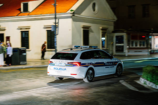 Dubrovnik, Croatia - 26 May, 2025: A Croatian Police car in motion at night