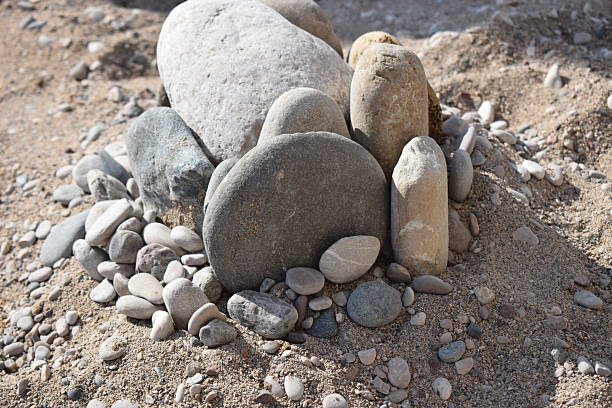Rocks on the sand beach. Closeup of sand and rocks at a beach