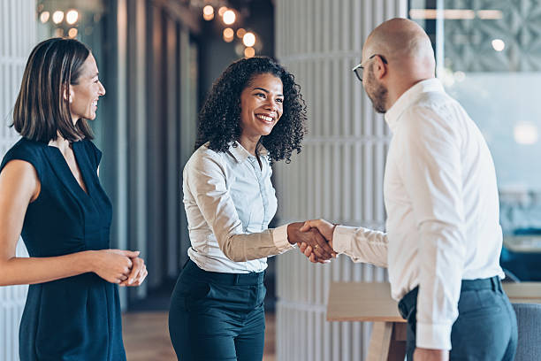 istock Business persons shaking hands in the office 2218313956