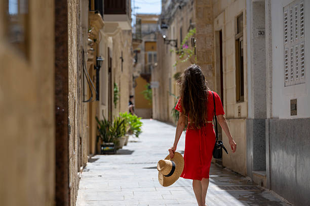istock Woman explores narrow streets, Malta 2218314259