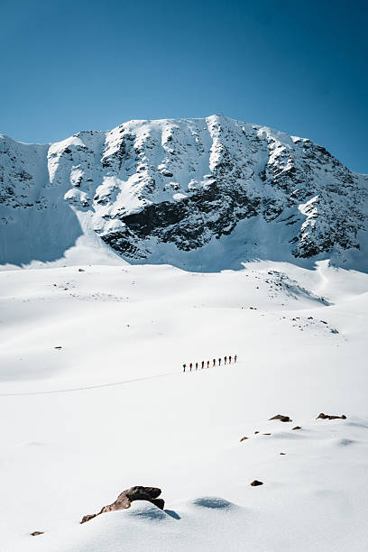 Very distant view of ski mountaineers Pitztal Glacier, Otztal Alps