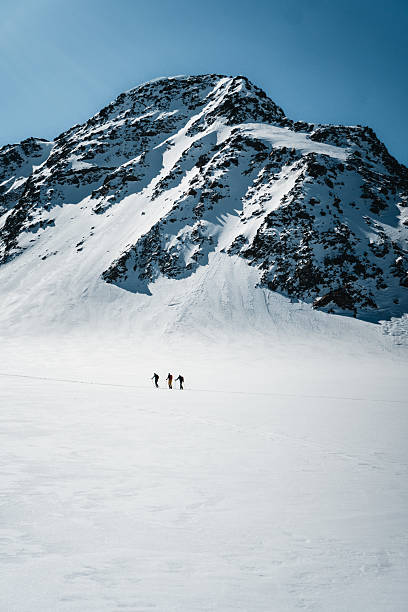 istock Very distant view of ski mountaineers 2218316540