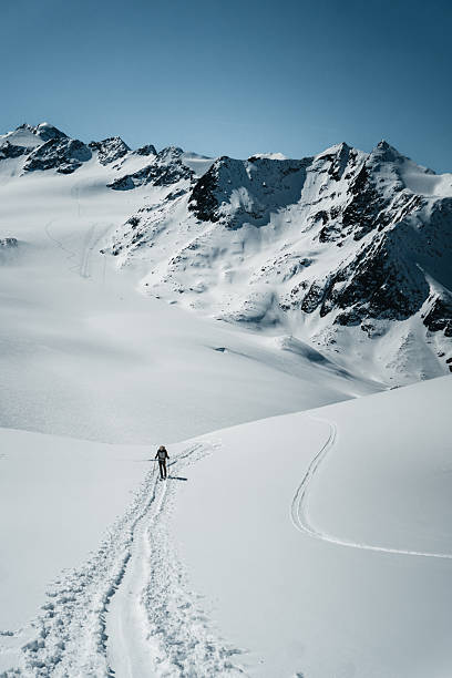 istock Distant view of backcountry skier on mountain 2218316610