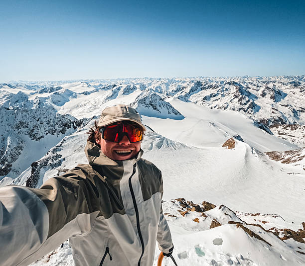Selfie of young man on mountain top, Pitztal Glacier, Otztal Alps