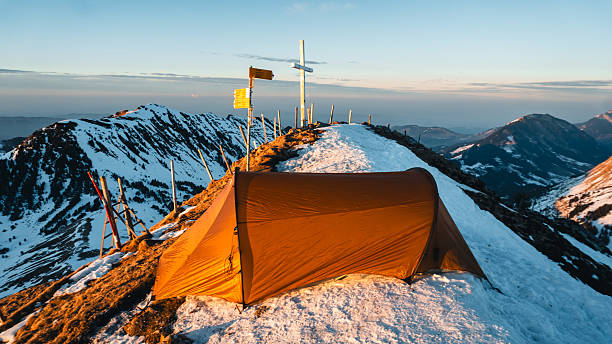 Sunrise from campsite on mountain peak, sign post, Mount Pilatus, Lucerne Canton, Swiss Alps