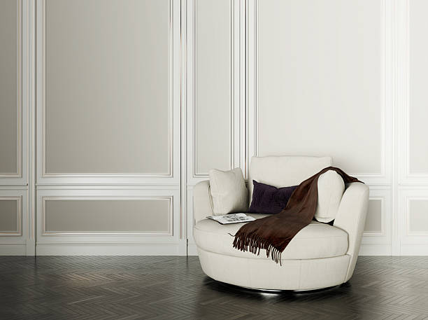 White Leather Chair near Wall and Window in Empty Interior Room