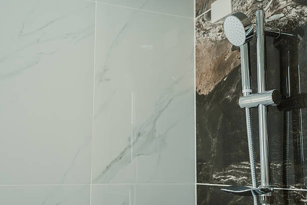 istock Modern Shower Head in Stylish Bathroom with Elegant Marble Wall Paneling and Clean Design Features 2218318181