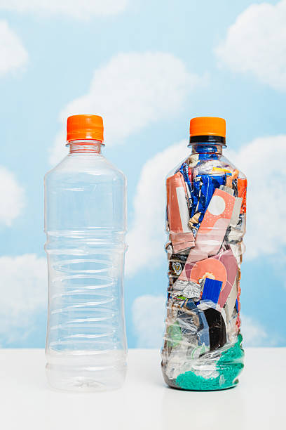 istock Empty and full plastic bottles side by side, concept of plastic waste compression 2218321250