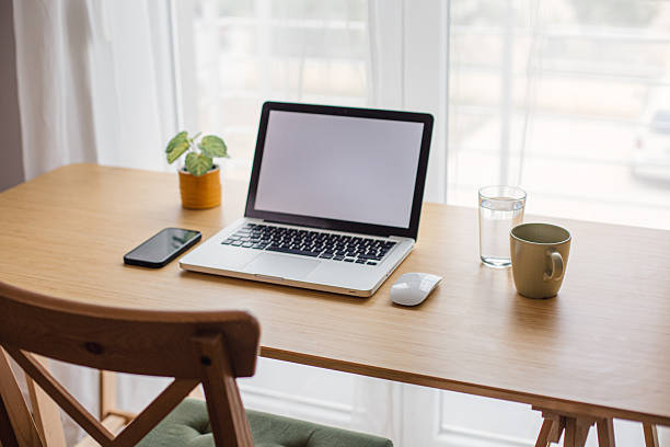 istock Modern home office setup with laptop and blank screen for remote work 2218326051