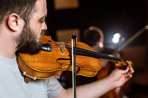 istock A young male violinist passionately performs on stage. 2218330626