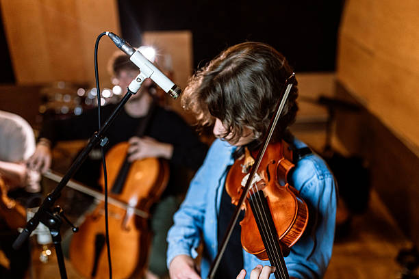 istock A young male violinist passionately performs on stage. 2218330898