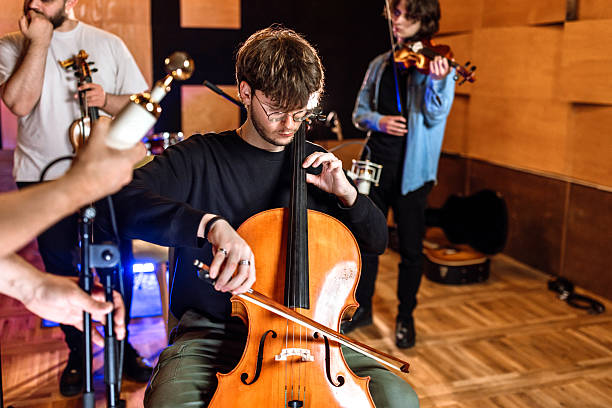istock A group of musicians playing in music recording studio. 2218331158