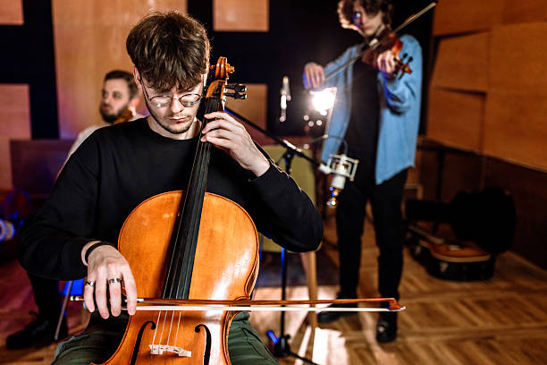 istock A group of musicians playing in music recording studio. 2218331363