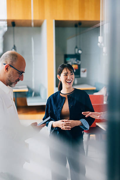 Professional Team in a Casual Conversation at a Modern Office Setting